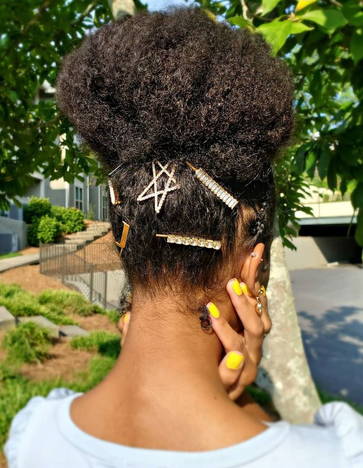 Natural updo decorated with decorative hair pins