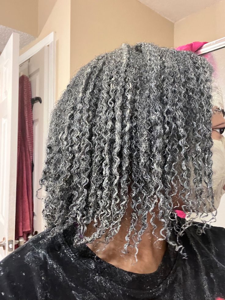 Woman deep conditioning natural 4C hair during summer
