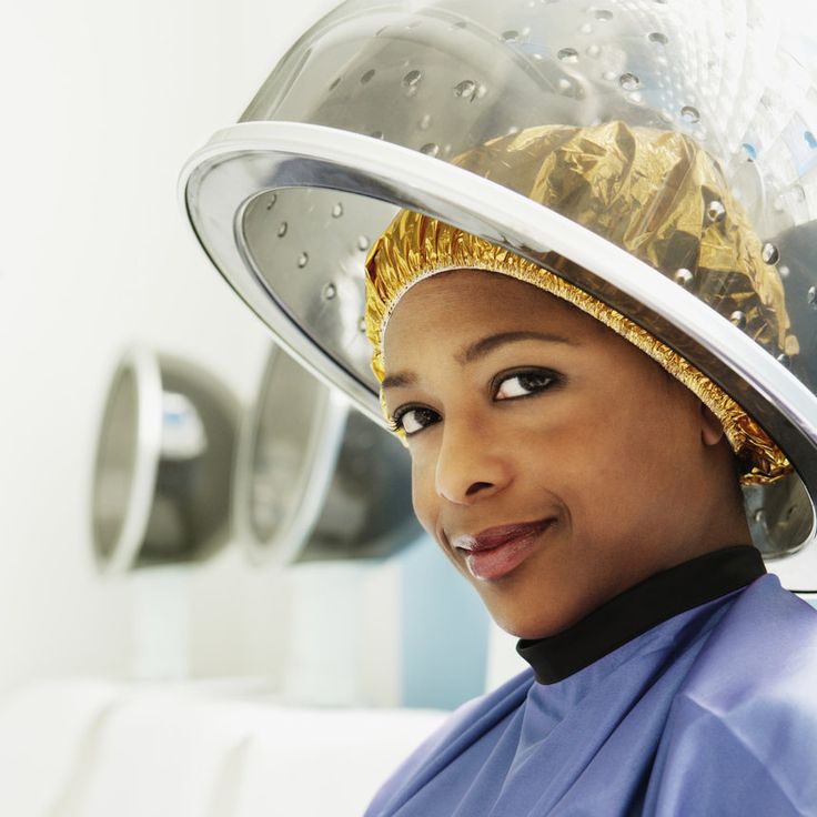 woman deep conditioning her hair after bleaching