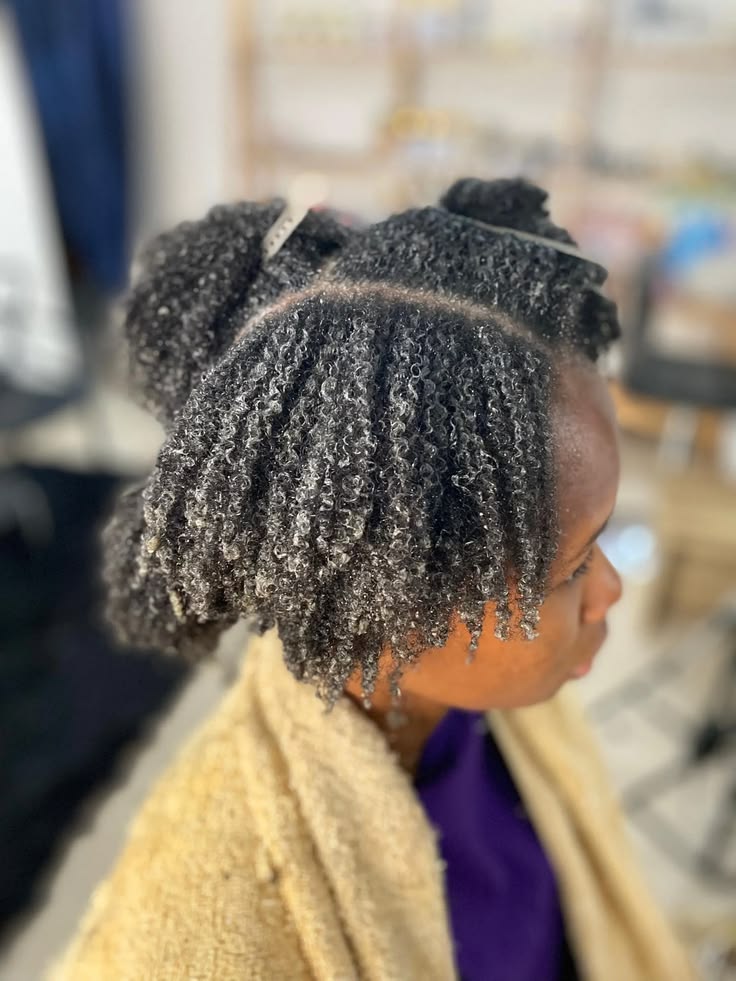 Woman deep conditioning natural hair before a color treatment