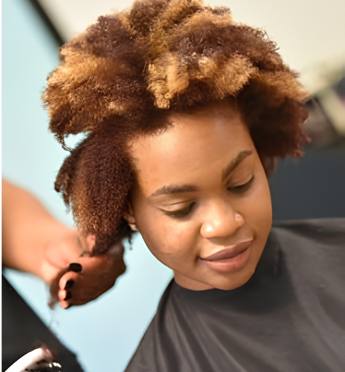 woman detangling colored hair gently