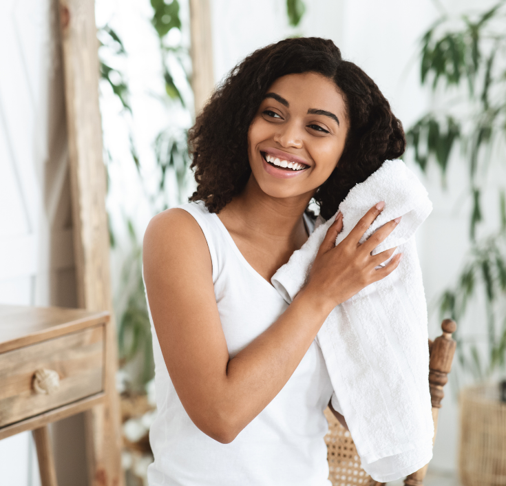 Natural hair being gently dried after washing