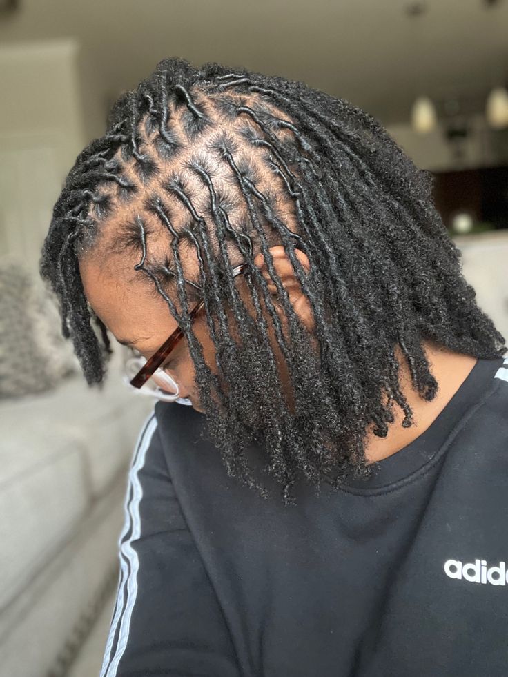 Early stage of starter locs showing natural frizz