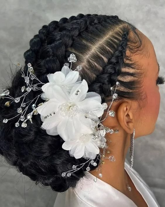 Woman wearing an elegant braided updo with hair accessories