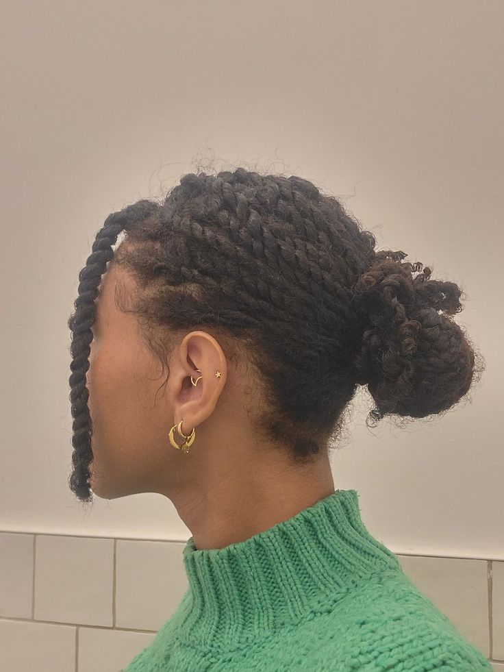 Woman wearing a gentle protective hairstyle on natural 4C hair