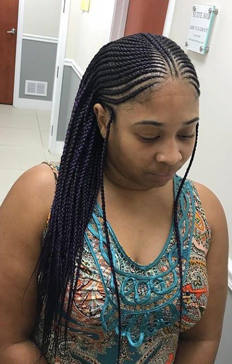 Woman wearing classic Ghana braids on natural 4C hair