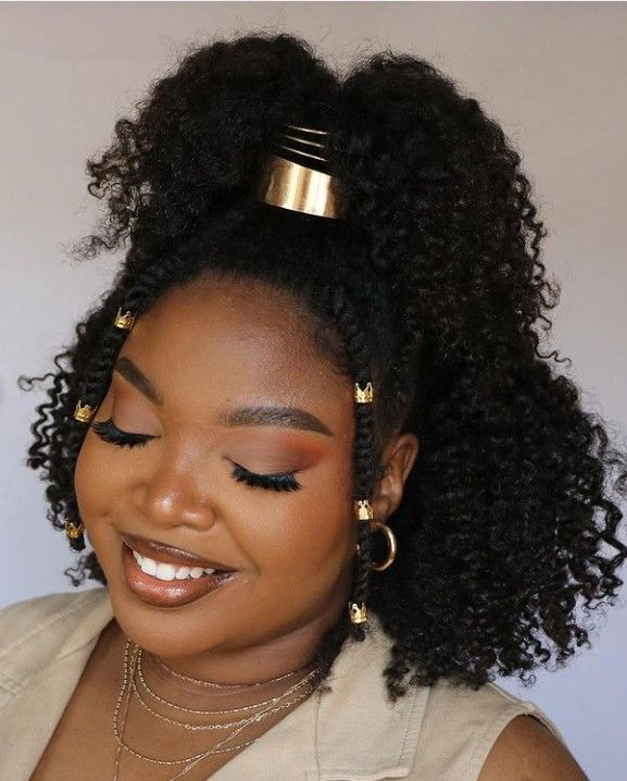 Twist-out hairstyle decorated with gold hair cuffs