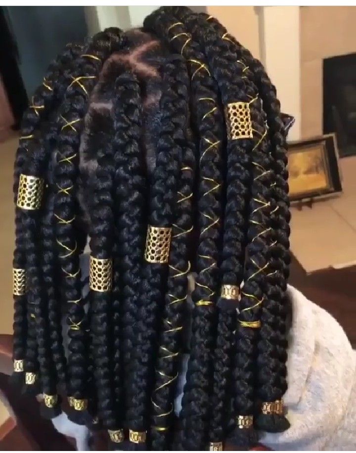 Natural braids decorated with gold thread