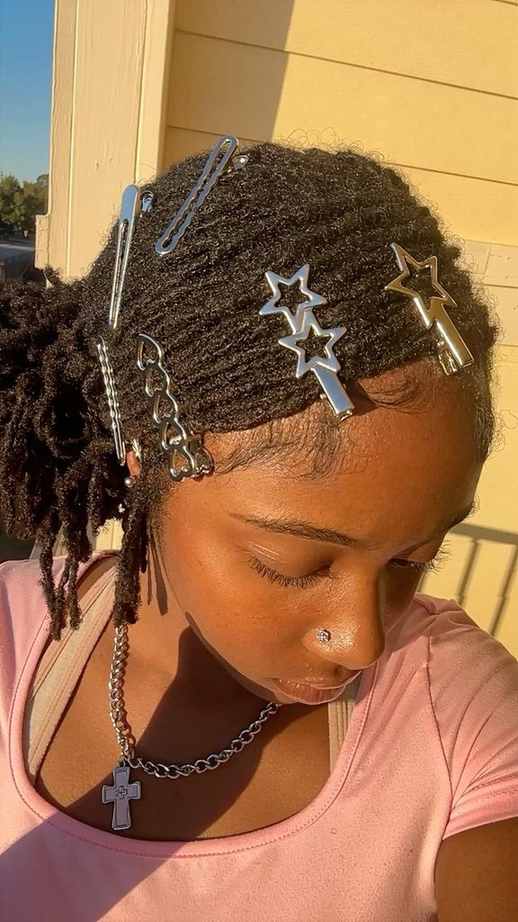 Short starter locs decorated with lightweight hair clips