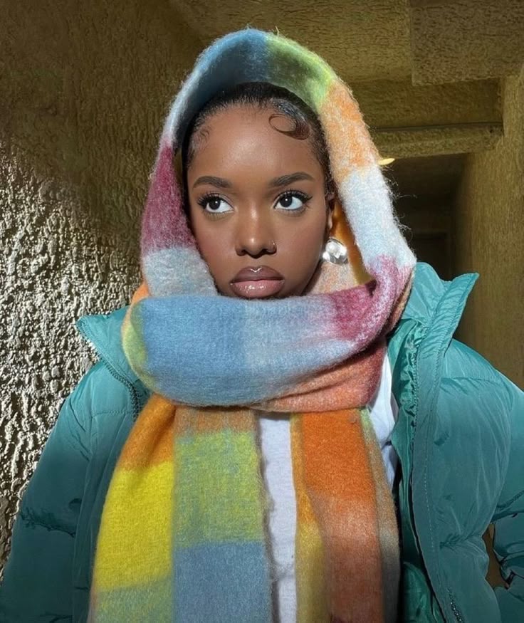 Woman protecting natural 4C hair with a scarf during winter