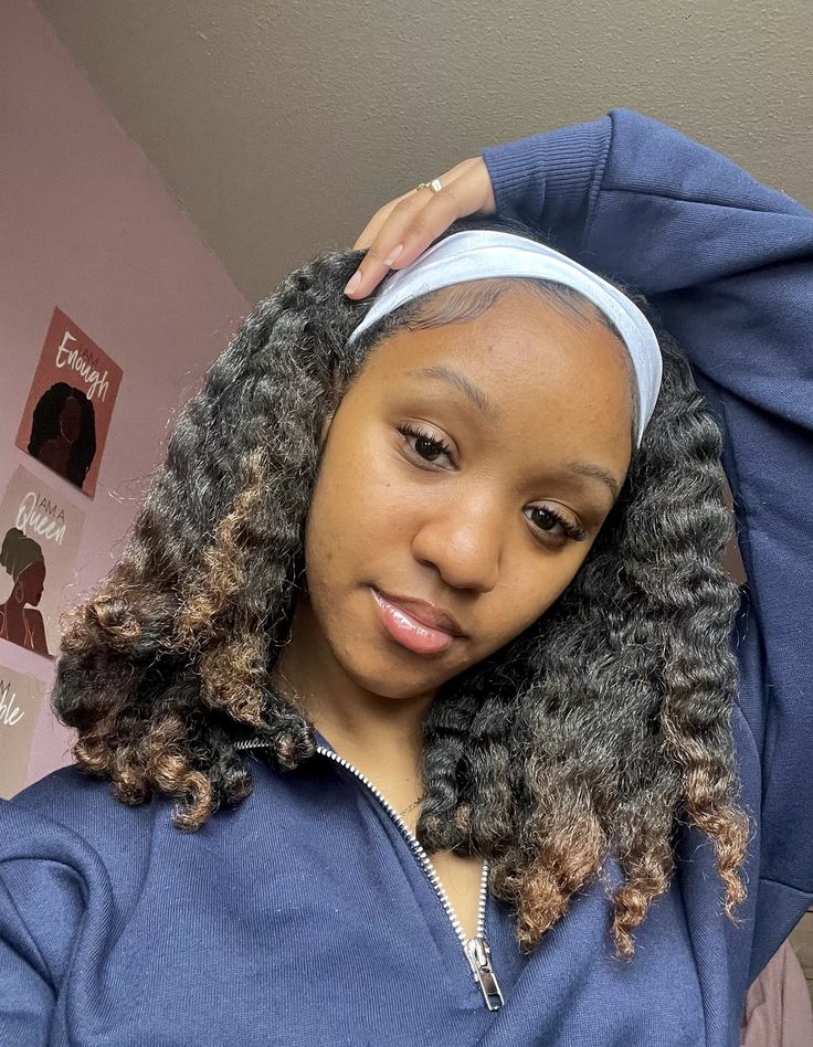 Twist-out hairstyle finished with a fabric headband