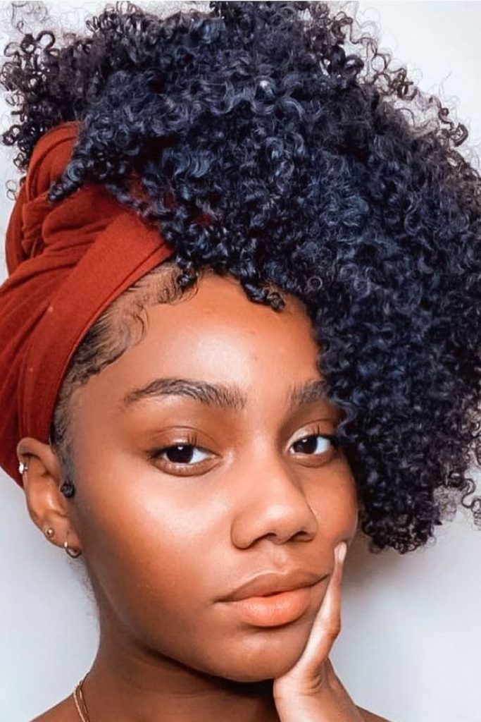 Twist-out hairstyle paired with a stylish headwrap