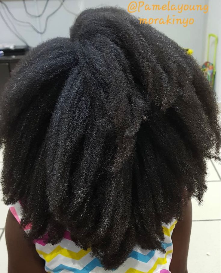 Woman with healthy long natural 4C hair