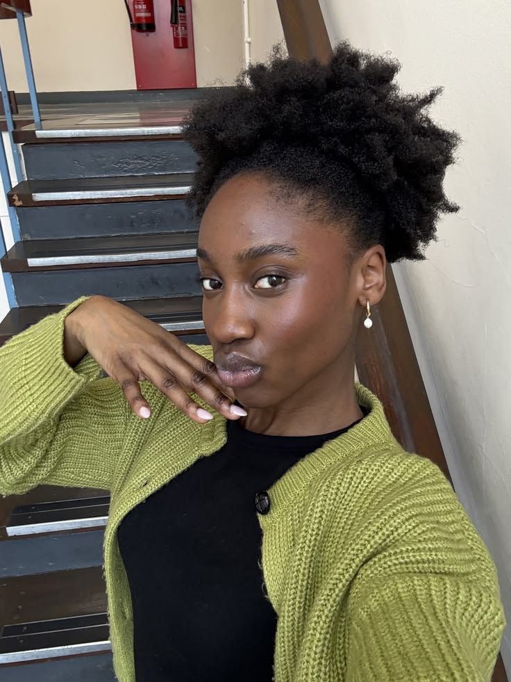 Woman with healthy moisturized natural 4C hair during winter