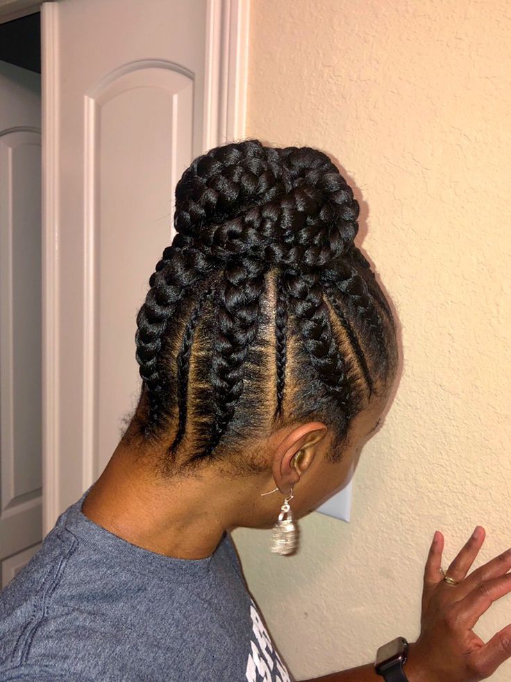 Woman wearing a high braided bun on natural hair