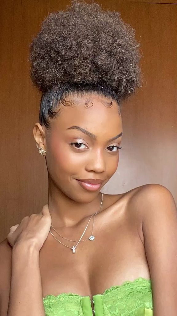 High puff hairstyle with neatly styled edges on 4C hair