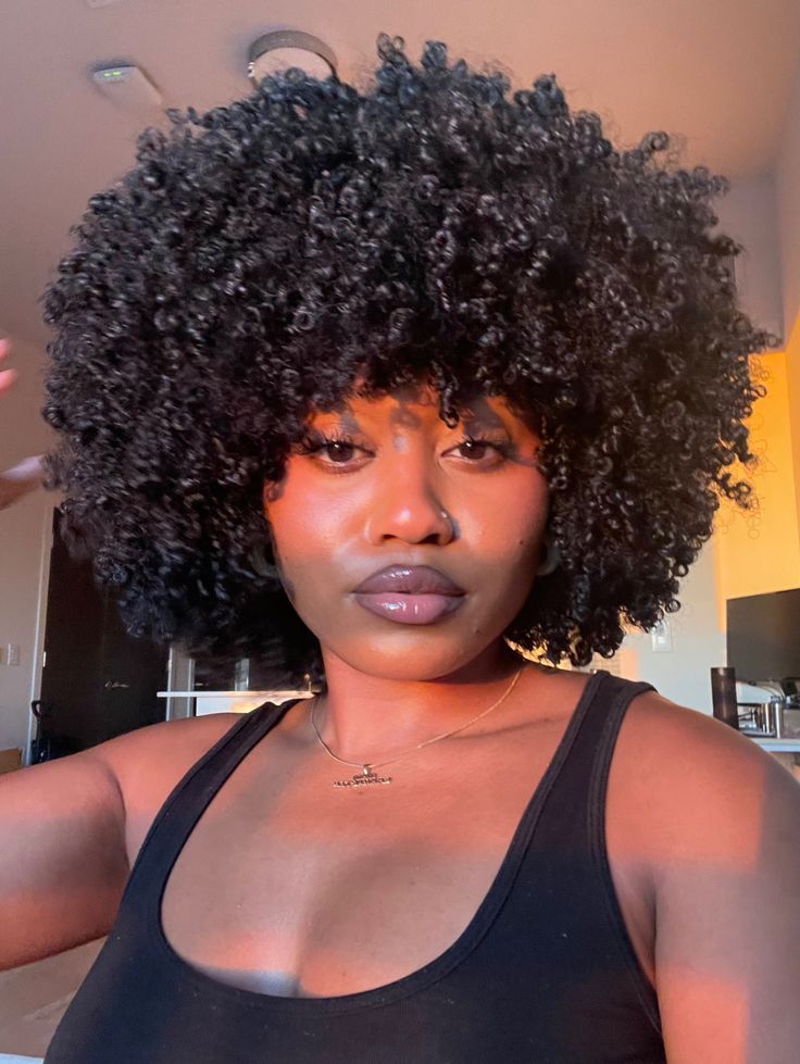  Black woman wearing jet black natural hair