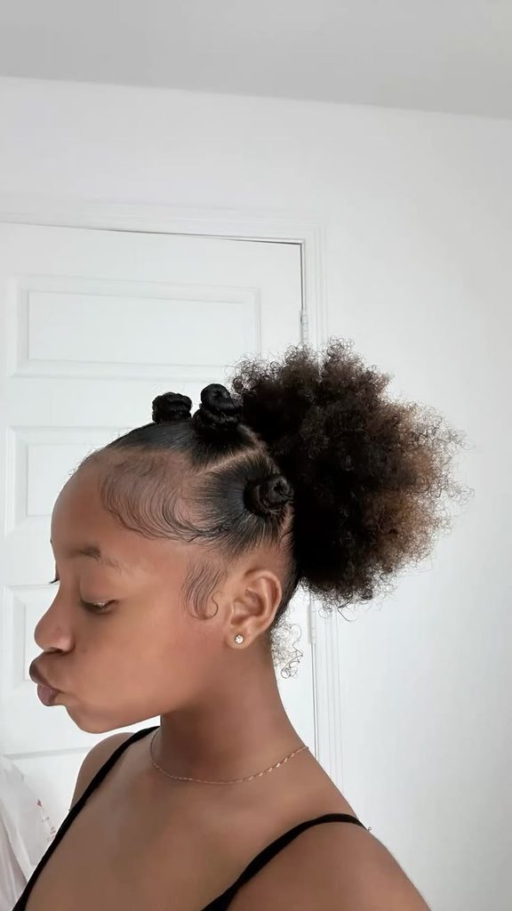 Bantu knots and puffs on a child with 4C hair
