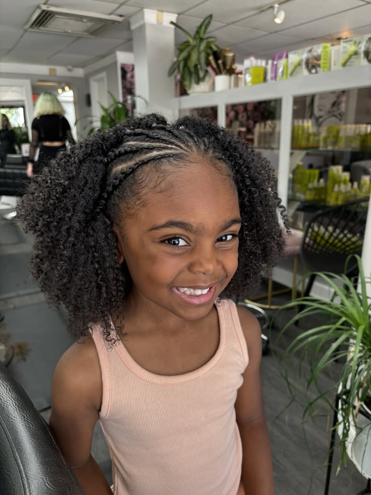 Chunky cornrows with loose ends on natural 4C hair