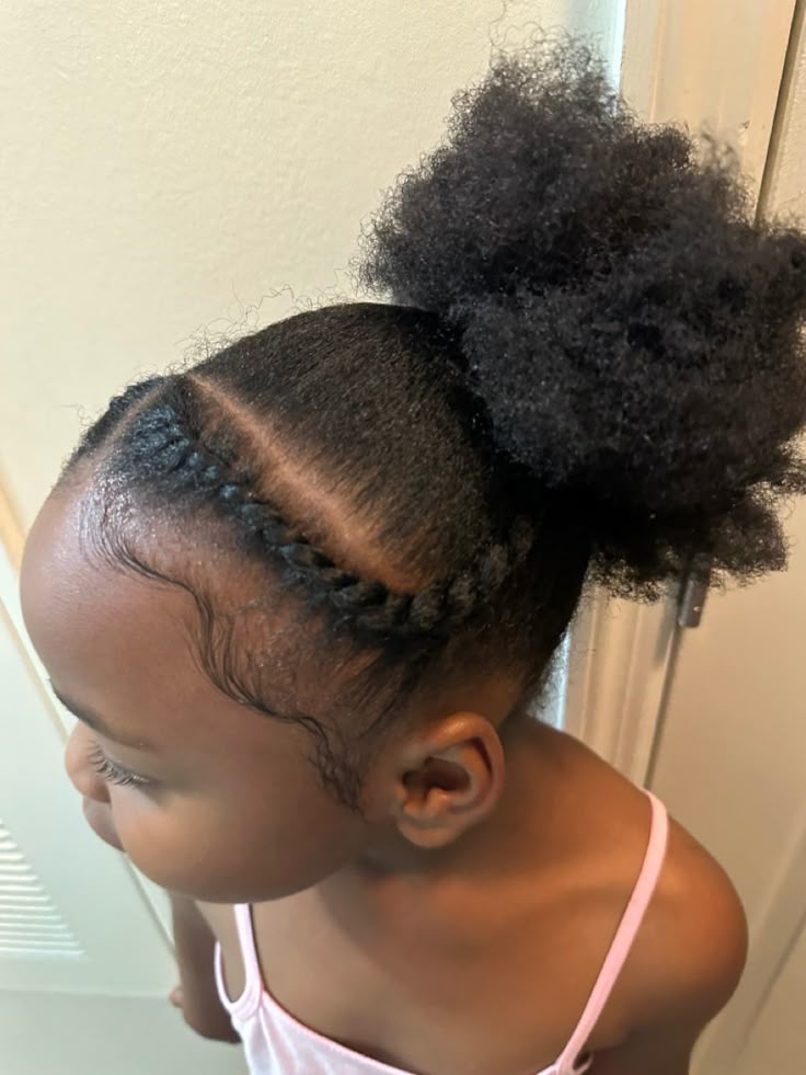 Flat-twist ponytail on a child with 4C hair
