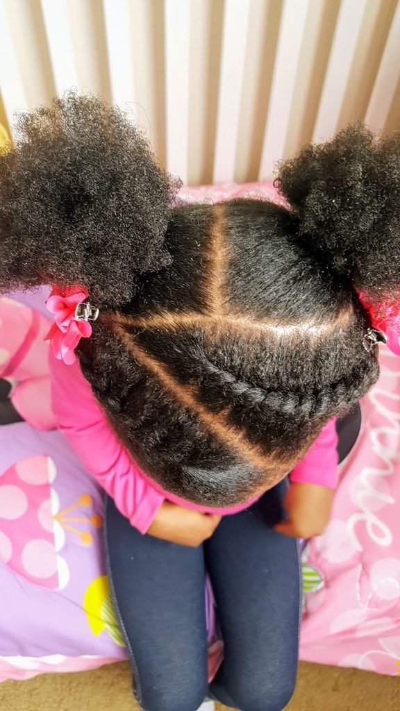 Flat twists ending in two puffs on 4C hair