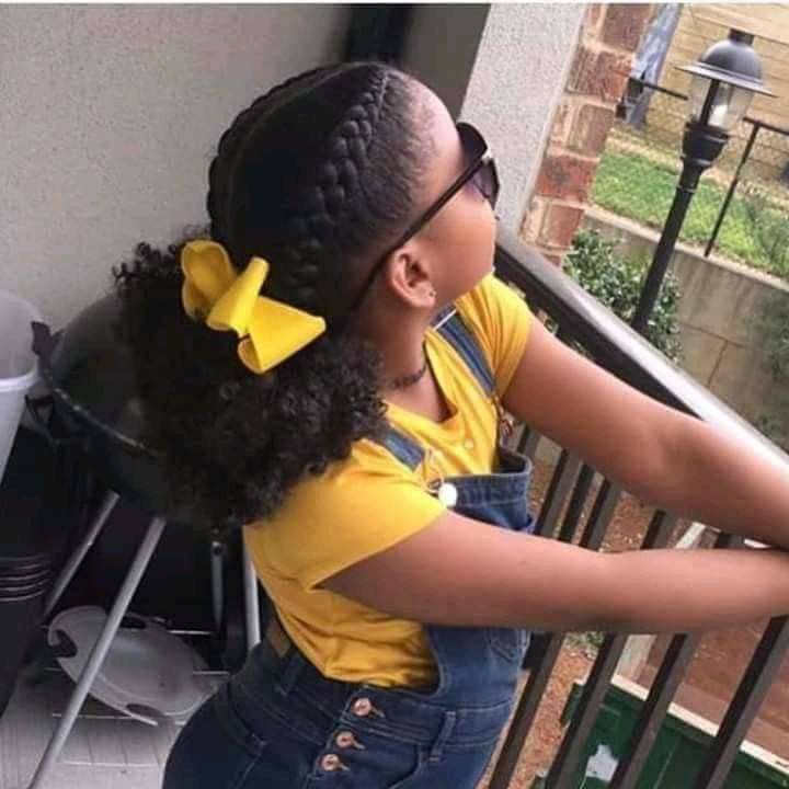Side ponytail with bow on natural 4C hair