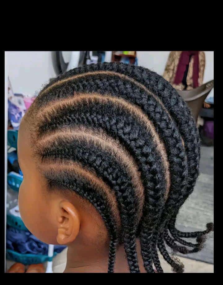 Straight-back cornrows on a child with natural 4C hair