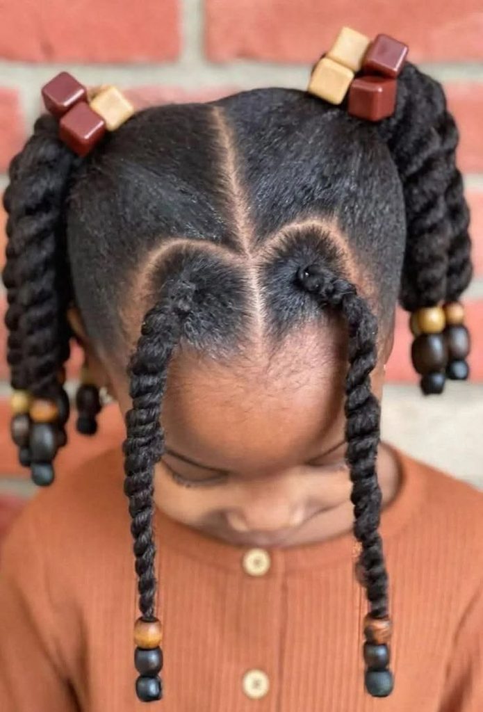 Twisted pigtails with beads on natural 4C hair