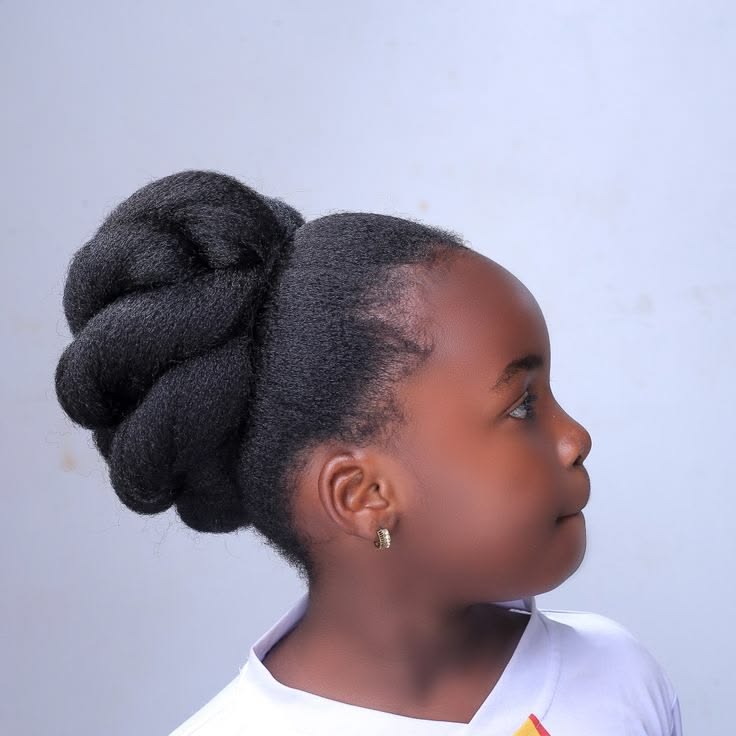 Wrapped updo on a child with natural 4C hair