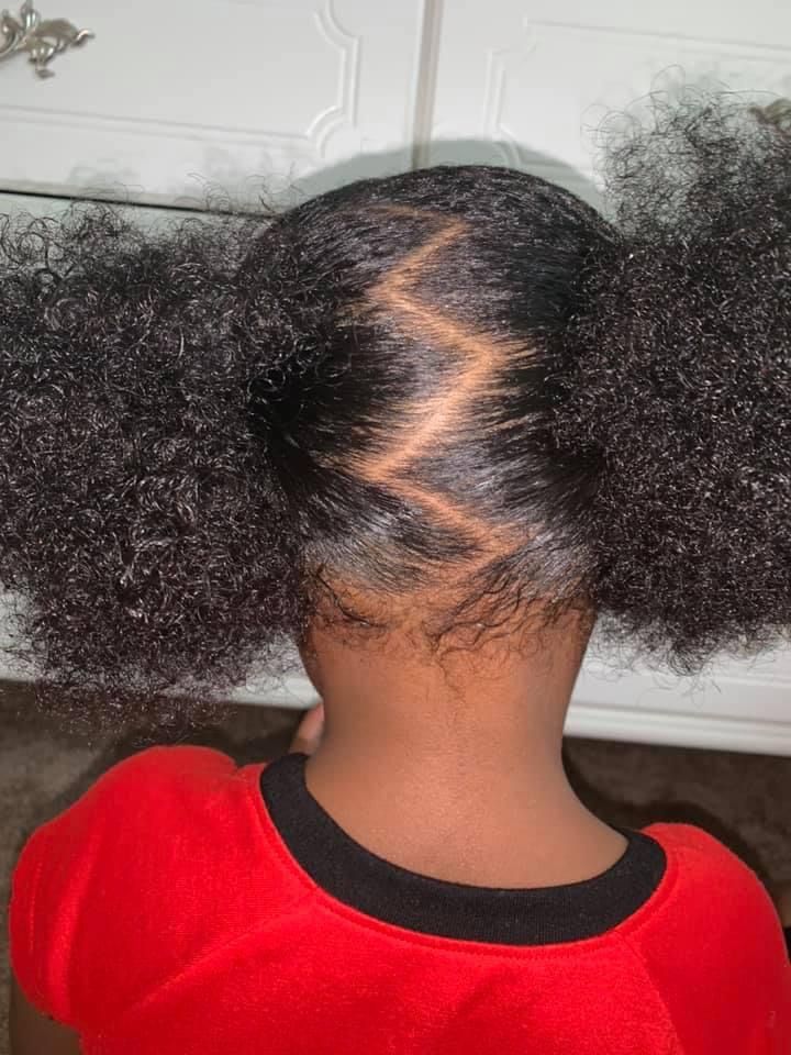 Zigzag parted puffs on natural 4C hair