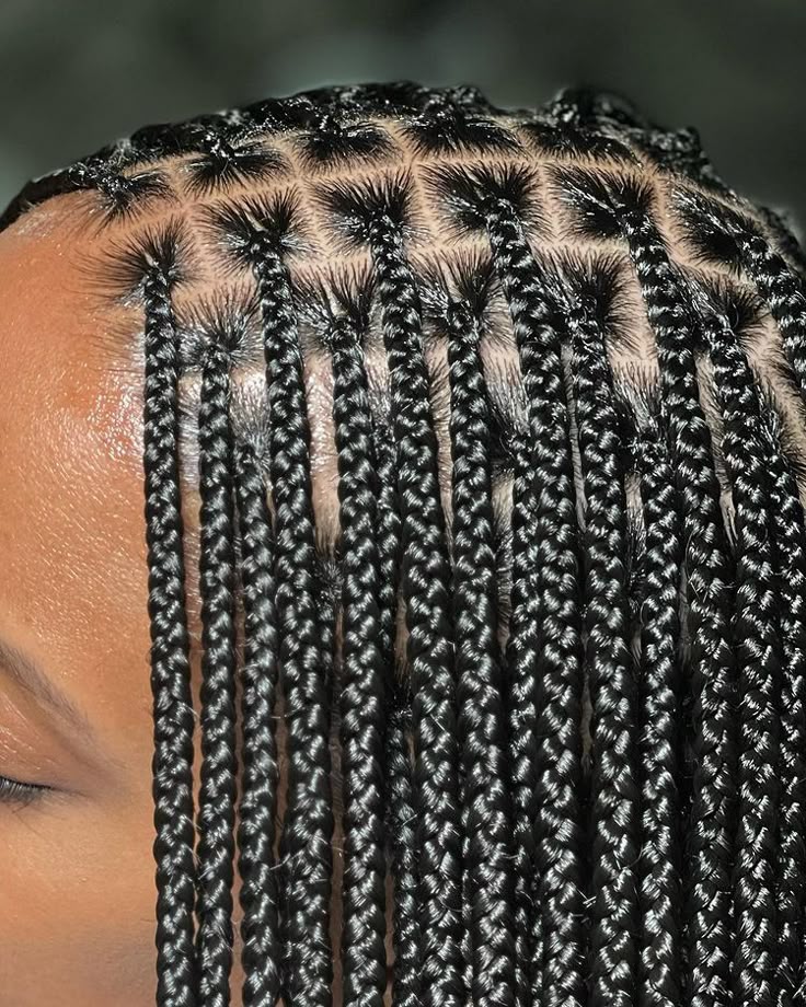 Woman wearing neat knotless braids for rainy day