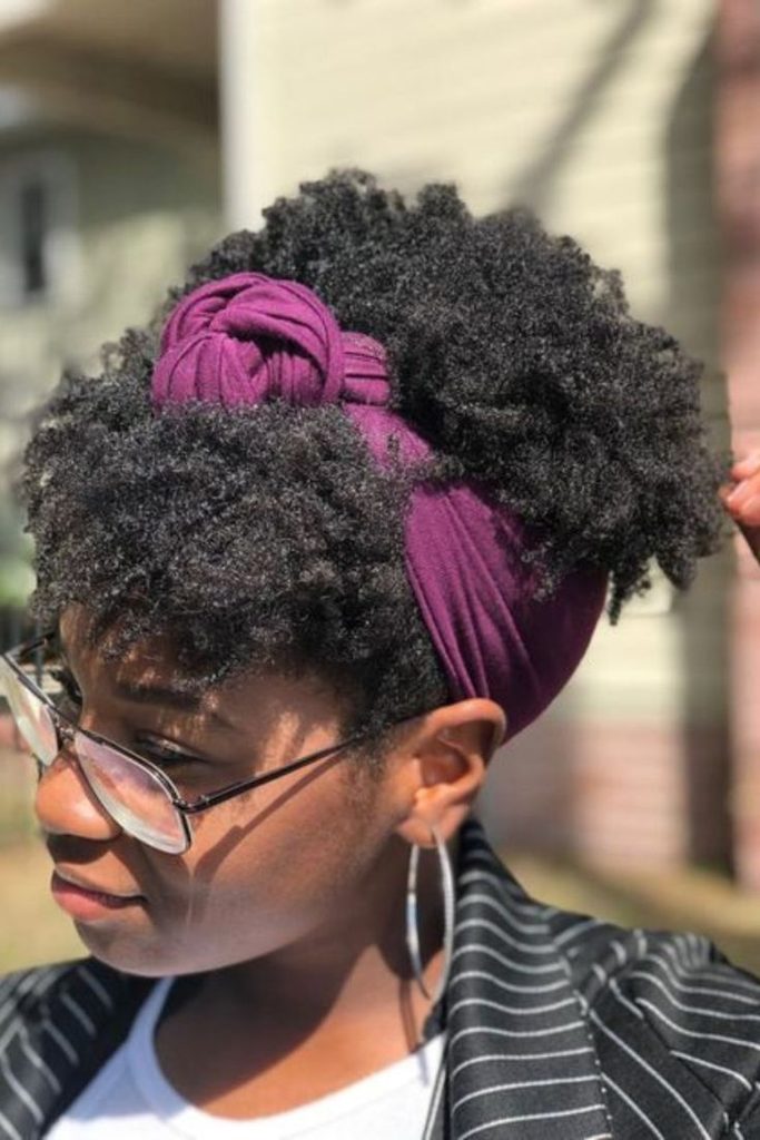 Natural hair styled with a knotted scarf