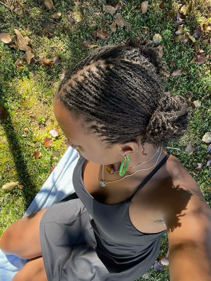 girl with microlocs outside