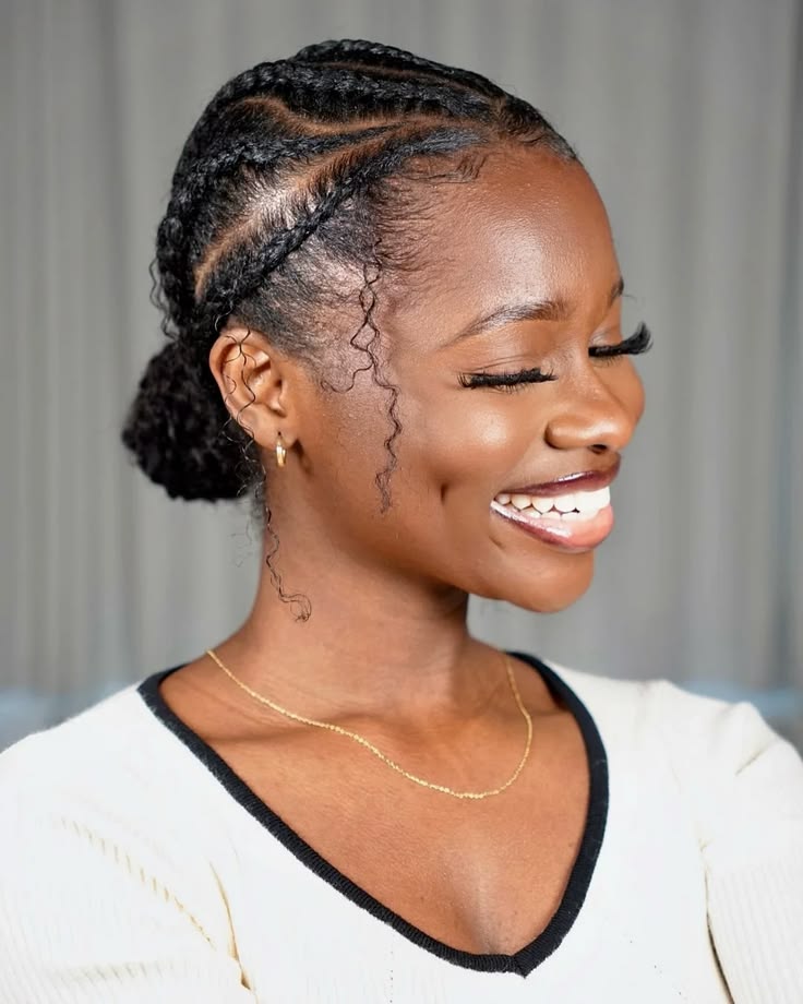 Woman wearing a low braided bun on natural hair for rainy day
