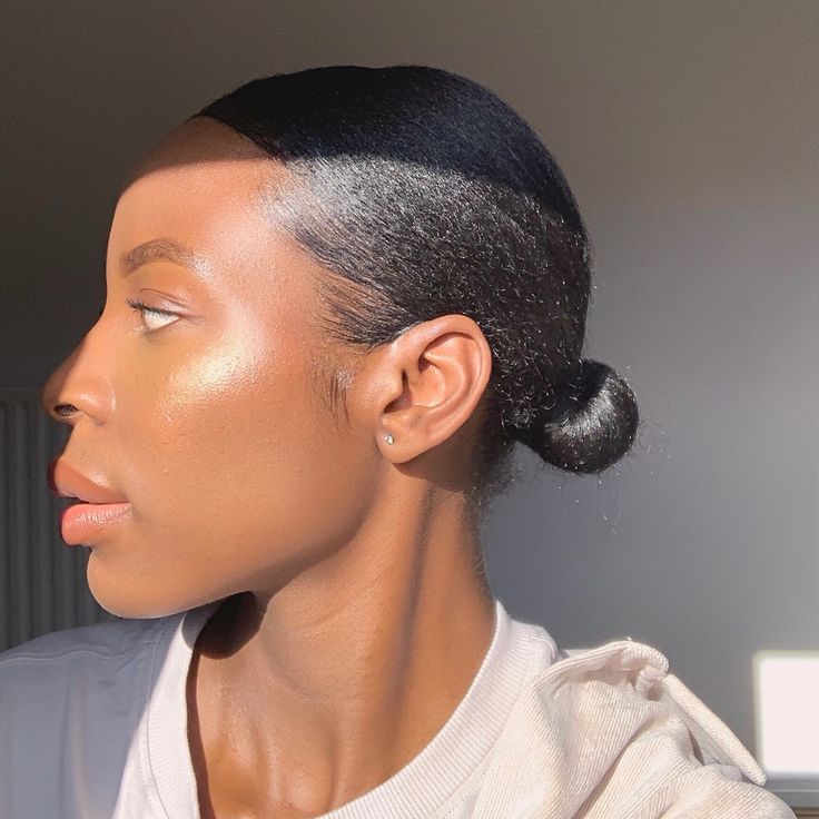 Simple low bun hairstyle for transitioning natural hair