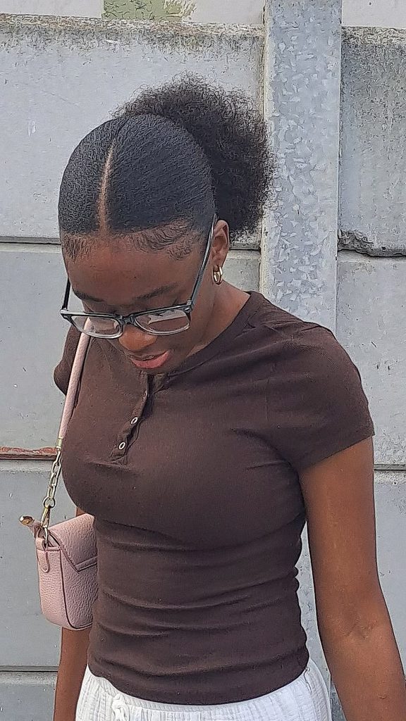Low puff hairstyle with a middle part on natural 4C hair