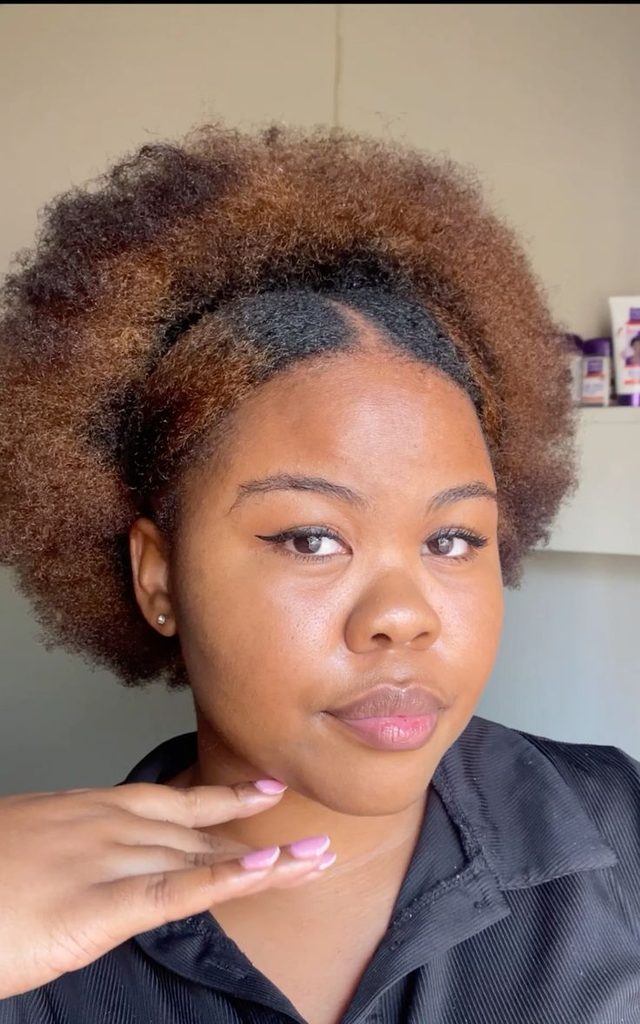 Natural 4C puff hairstyle with a clean middle part