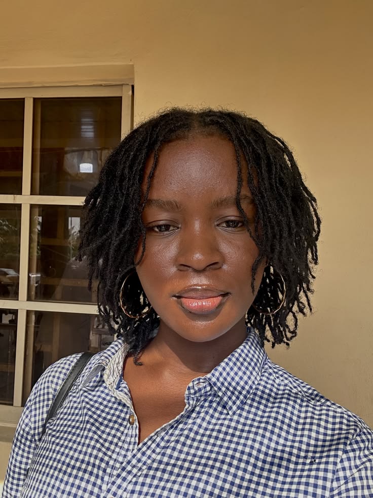 Short starter loc with a neat middle part