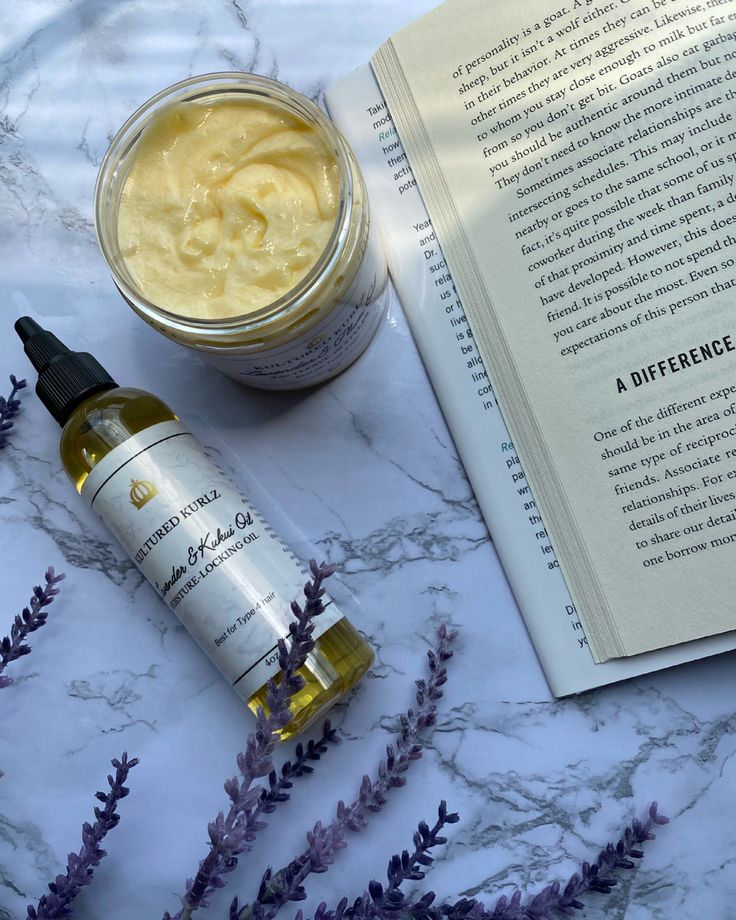 Natural hair oils and butters arranged for a summer hair routine