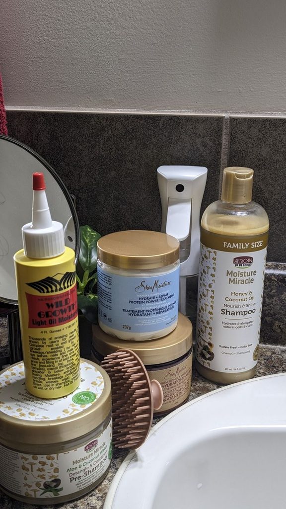 Natural hair products arranged for a simple transitioning hair routine