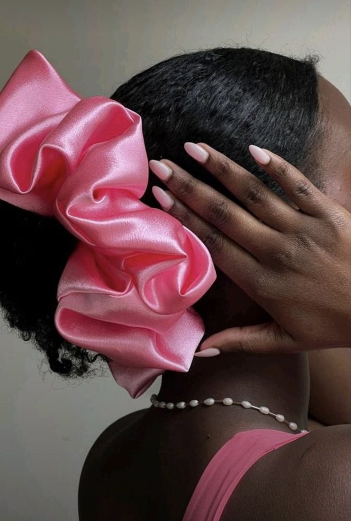 Natural hair styled with an oversized scrunchie