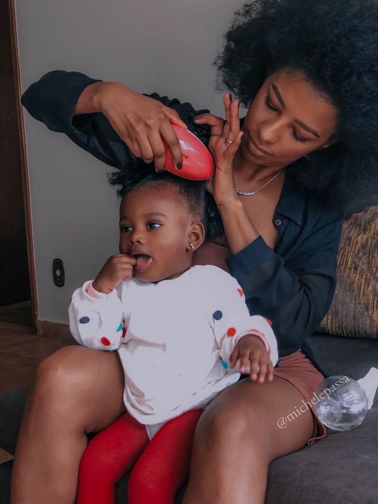 Parent and child enjoying a calm natural hair detangling routine together
