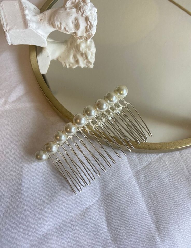 Natural updo decorated with a pearl hair comb