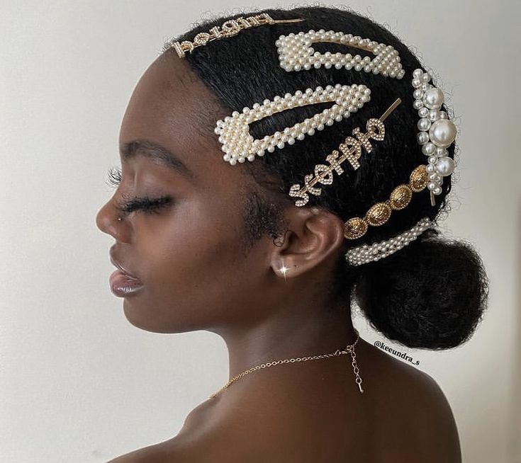 Natural hair updo decorated with pearl pins