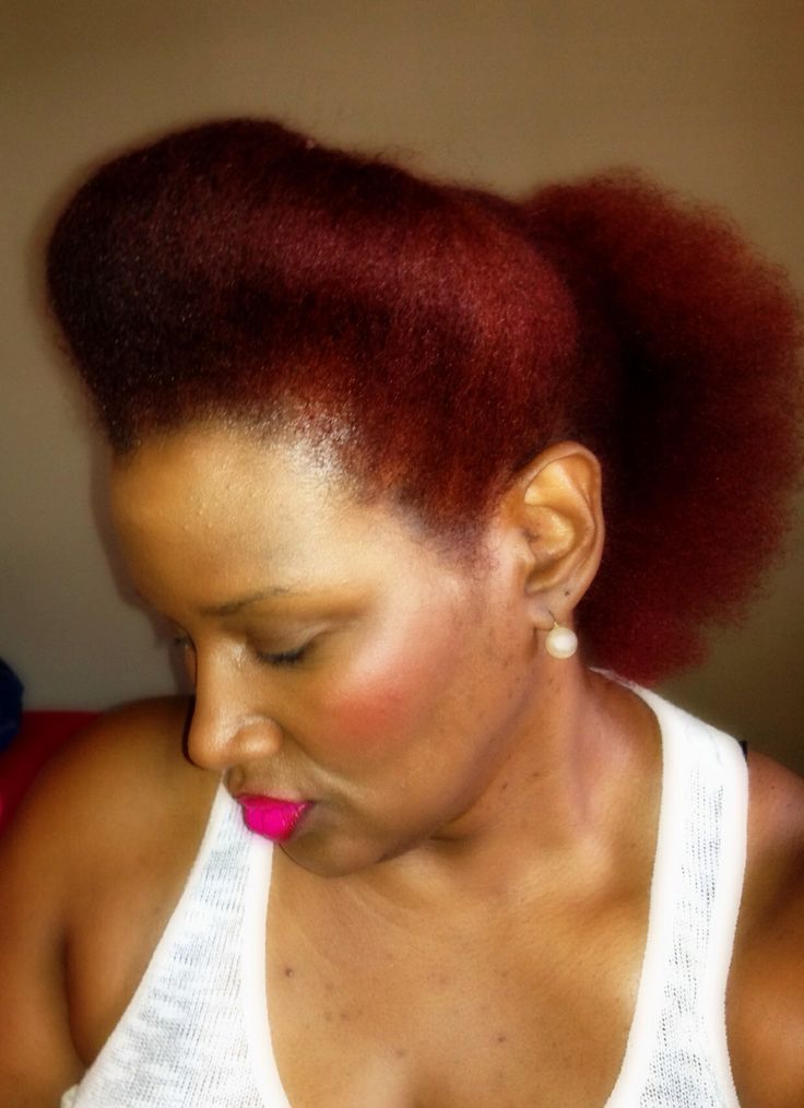 Natural 4C puff hairstyle with a raised pompadour front