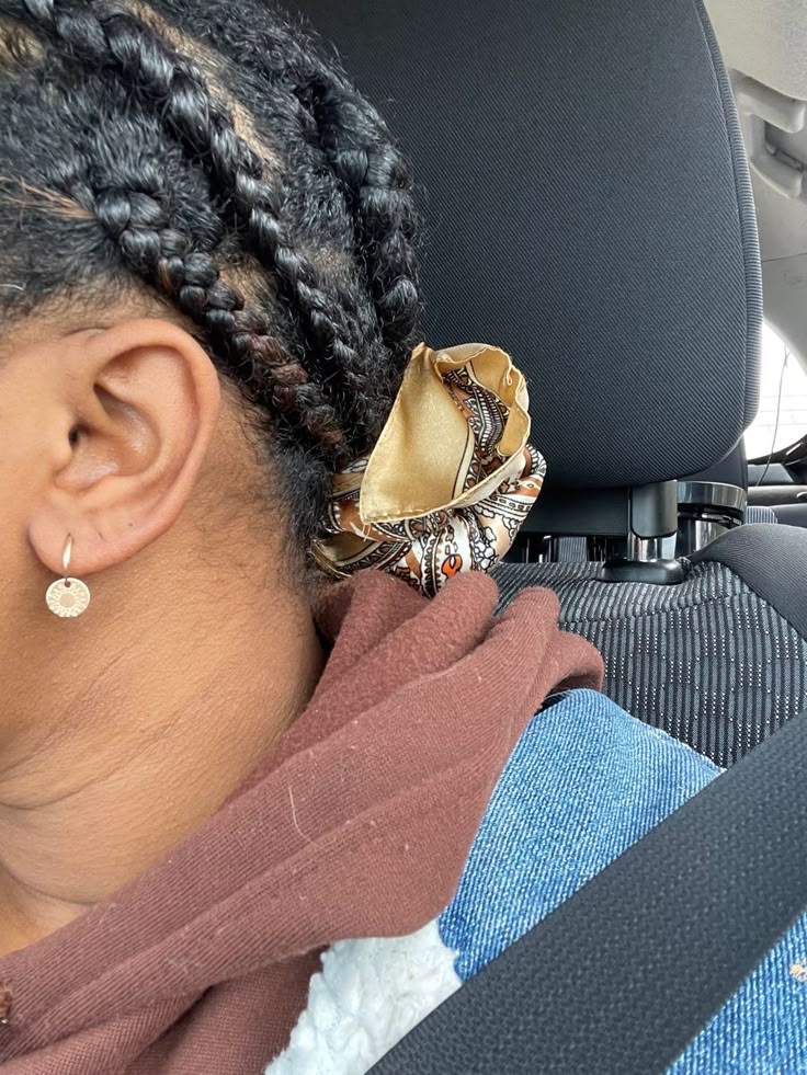 close up of hair ends being protected by satin scarf