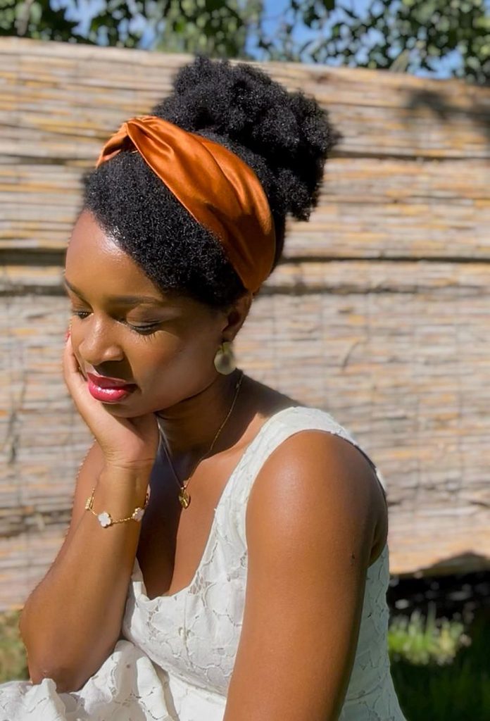Woman wearing a satin headband with natural hair