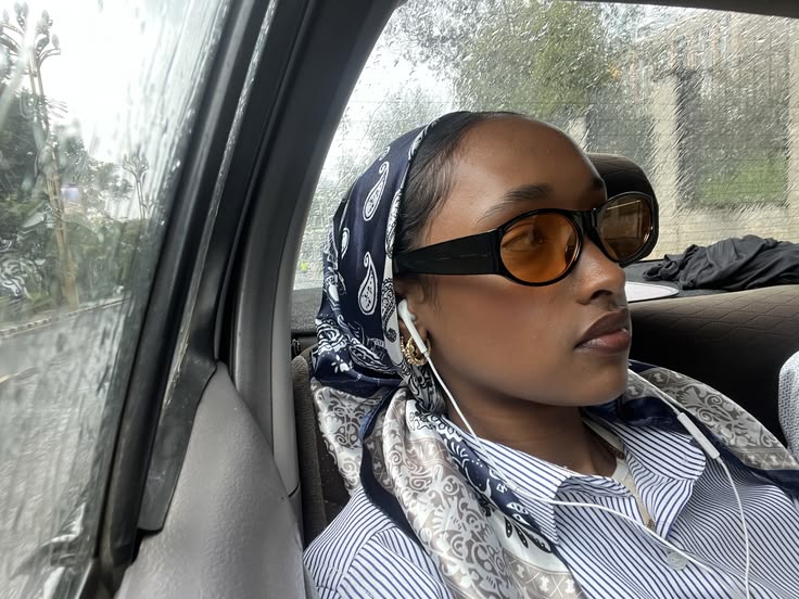 Satin scarf protecting natural hair from rainy weather