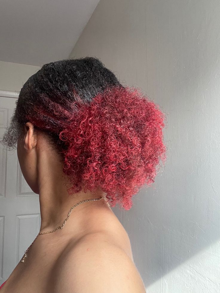 Woman applying semi-permanent color to 4C natural hair