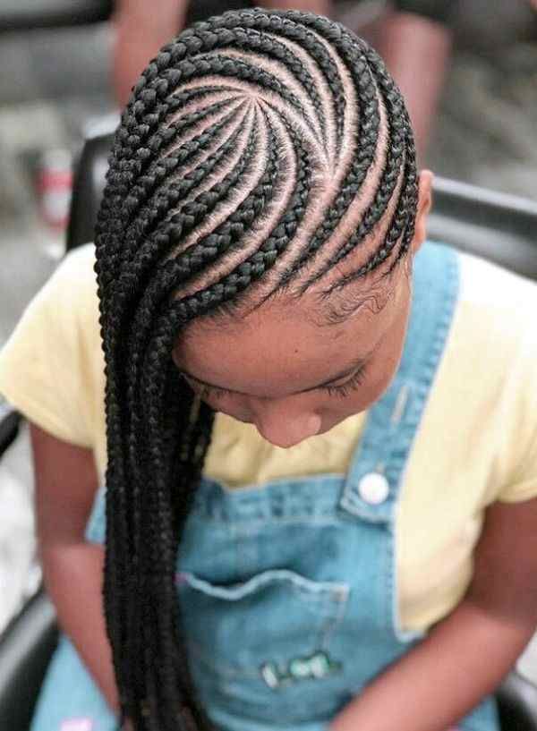 Woman wearing side-swept cornrows on natural hair